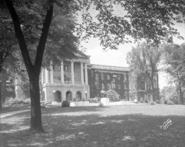 View across lawn towards the front of Bascom Hall (formerly Main Hall) on the University of Wisconsin-Madison campus. The statue of Abraham Lincoln is in front of the entrance.