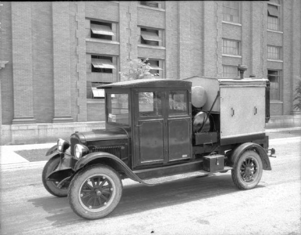 Compressing machine manufactured by Wisconsin Foundry and Machine Company on truck, from left front.
