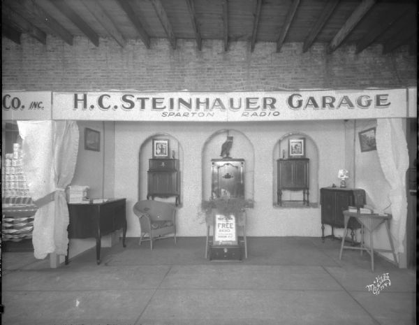 H.G. Steinhauer Garage booth at East Side Business Men's Association's (ESBMA) Fall Festival at Sugar Beet factory on Sugar Avenue, displaying Spartan radios.