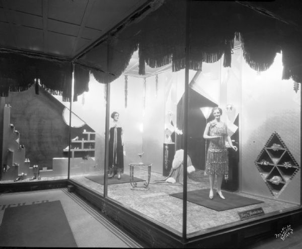 Harry S. Manchester, Inc., at 2 West Mifflin Street. Dresses are on display in the window.
