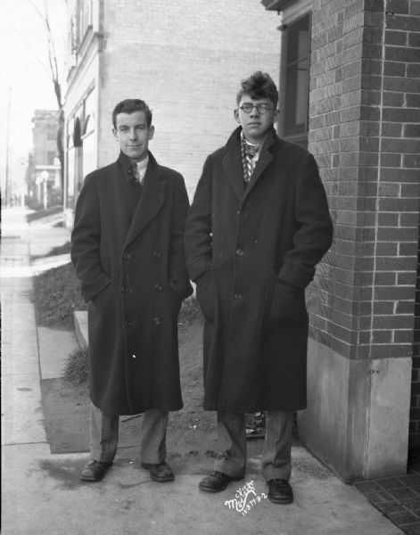 Two men in dress clothes. For Arthur Trowell Inc. Advertising.