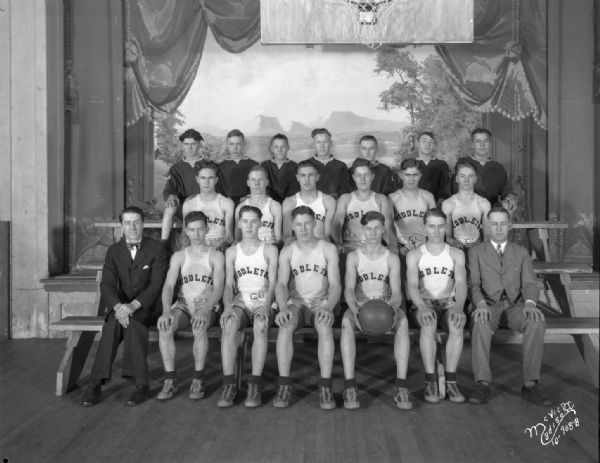 Indoor group portrait of the Middleton High School boys' basketball team.