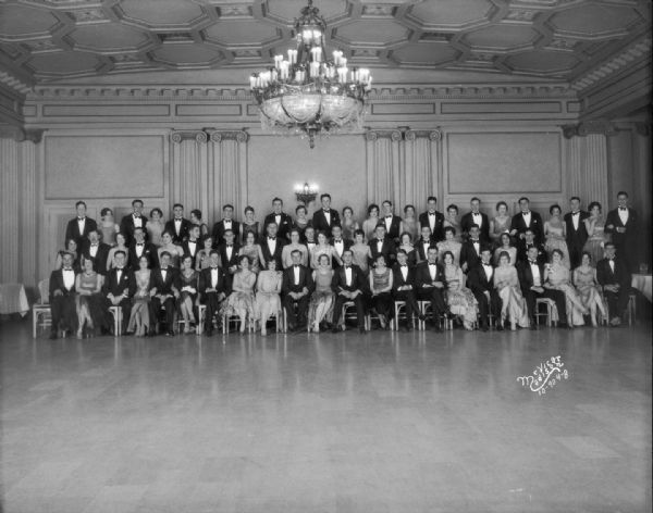 Phi Sigma Delta fraternity dinner dance group portrait in the Crystal Ballroom at the Loraine Hotel.
