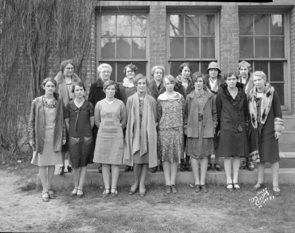 Central High School girls' club officers (Tycoberahn) and advisors group portrait, with fifteen women and girls standing.
