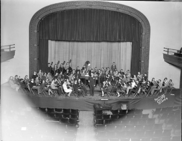 Elevated view of the Central High School orchestra on the stage. Richard C. Church, conductor.