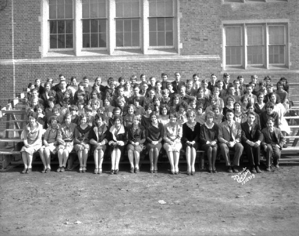 Outdoor group portrait of the East High School Dramatics club.