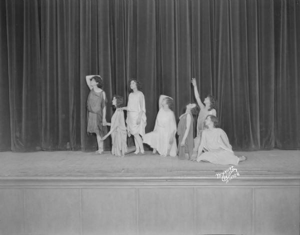 East High School girls performing an interpretive dance on stage.