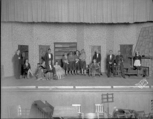 East High School play cast for "Captain Applejack" on a stage.