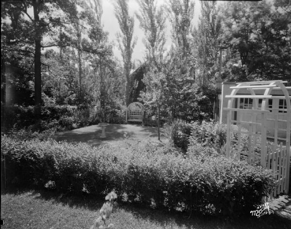 Garden behind a house, location unknown, taken for McKay Nursery.