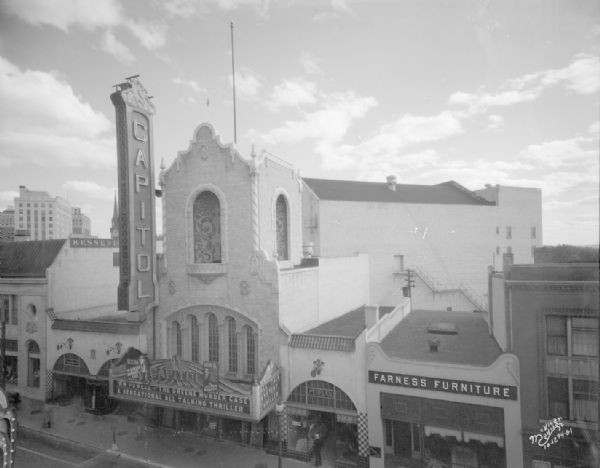 Elevated view of the Capitol Theatre tower, with Farness Furniture store on the right.