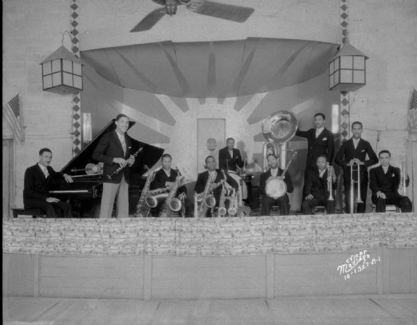 Broadway Gardens Orchestra. Ten musicians are posing on stage.