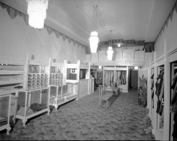Art Deco interior of women's clothing store, 11 E. Main Street. The view is from the front of the store towards the back.