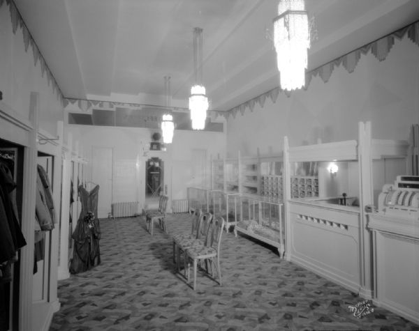 Art Deco interior of women's clothing store, 11 E. Main Street. The view is from the rear of the store.