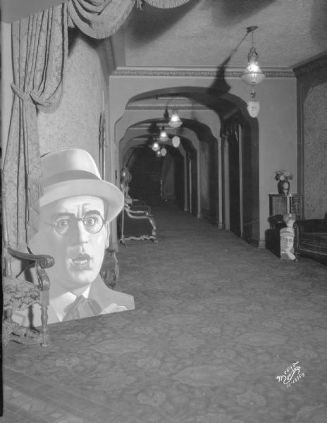 Capitol Theatre lobby showing Harold Lloyd advertising for "Welcome Danger." 209 State Street.