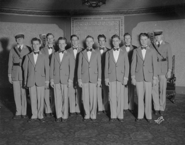 Group portrait of ushers, all male, at the Capitol Theatre.
