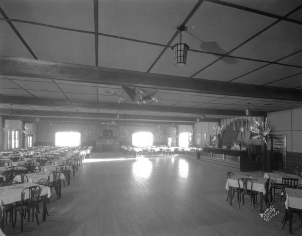 Interior view of the Chanticleer Roadhouse ballroom. Along the right wall is the bandstand, and on the far wall in the background is a large fireplace.