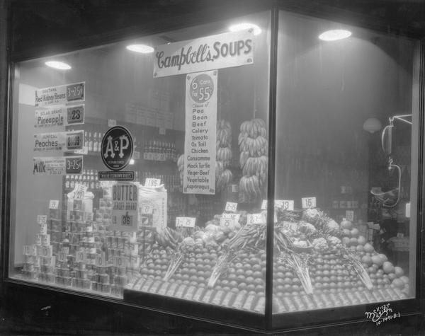 A & P grocery store window featuring fruits, vegetables and canned goods at 807 University Avenue.