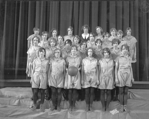 Indoor group portrait of the East High School girls sophmore basketball team.