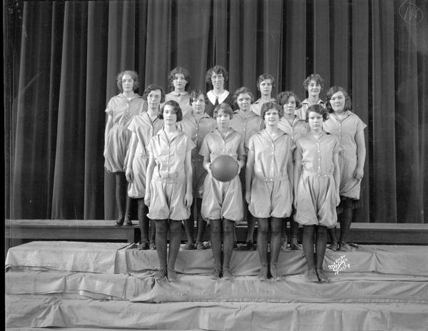 Group portrait of the East High School girls senior basketball team.