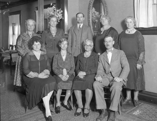 Vogel family group portrait with seven women and two men.