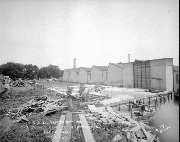 University of Wisconsin Mechanical Engineering Building. The foundation is under construction, showing engineering shop buildings in the background. 1513 University Avenue.