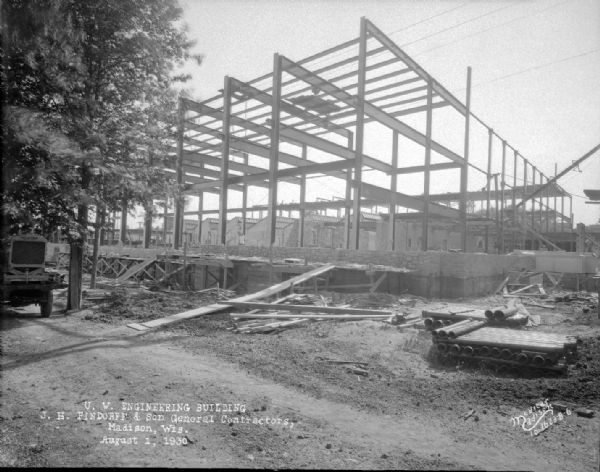 University of Wisconsin Mechanical Engineering Building, under construction, showing steel framework and lower stonework, 1513 University Avenue.
