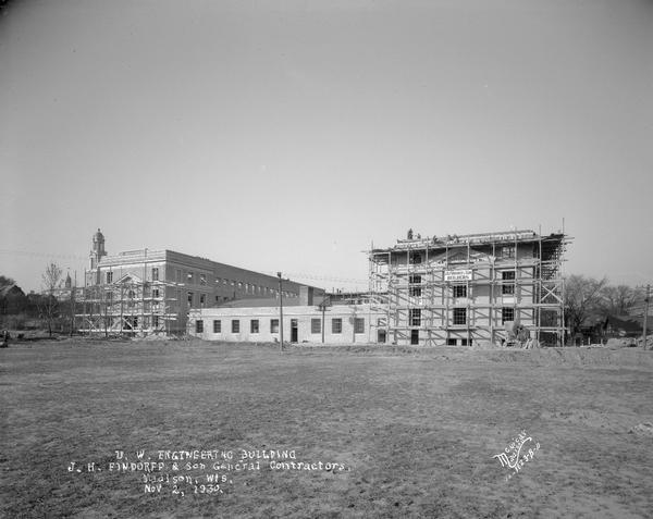 University of Wisconsin Mechanical Engineering Building, under construction, showing scaffolding around building and Findorff Builders sign, 1513 University Avenue. View from the south.