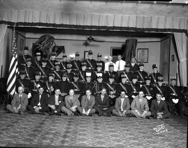 Group portrait of 4 Lakes Canton #3 of I.O.O.F. (Independent Order of Odd Fellows), majority of the men are in uniform. Taken in Odd Fellows Hall, 308 West Miffln Street.