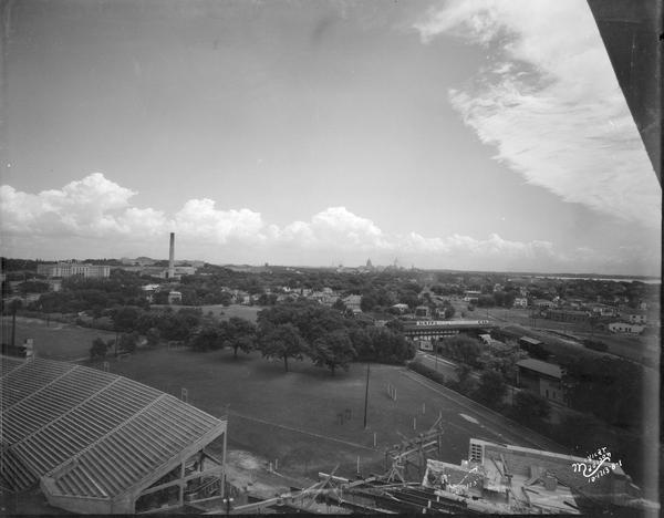 Elevated view of the Madison skyline from the University of Wisconsin-Madison Field House, showing the Wisconsin State Capitol and Gateway Lumber Co., 1429 Monroe Street.