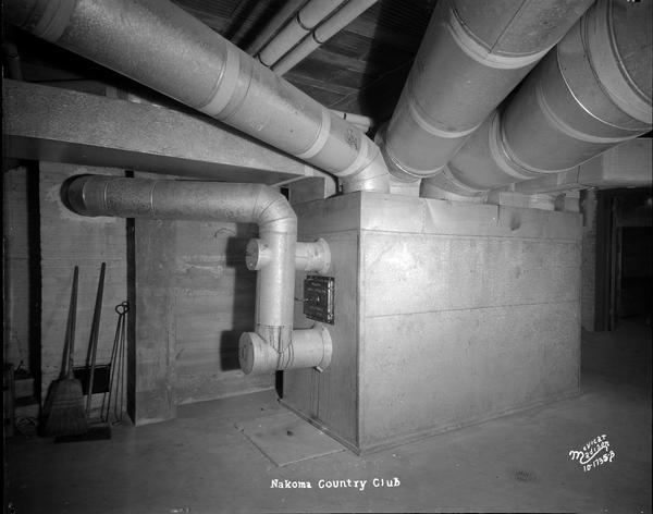 Ventilation pipes and furnace in basement of Nakoma Country Club.