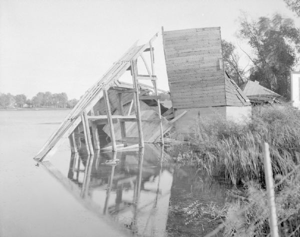 View along shoreline towards a collapsed ice house.