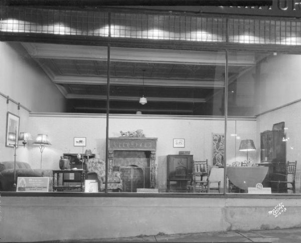 Frautschi window display, 213-221 State Street. The window is featuring a GE radio, and living room furniture.