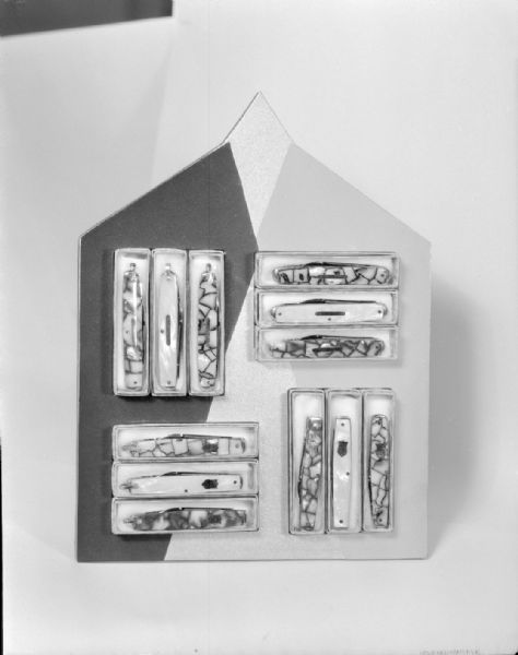 Display of pocket knives. Photograph for Wisconsin Engraving Co.