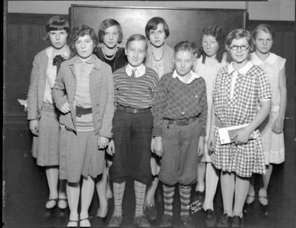 Group portrait of nine children who were "School page" editors for the "Capital Times."