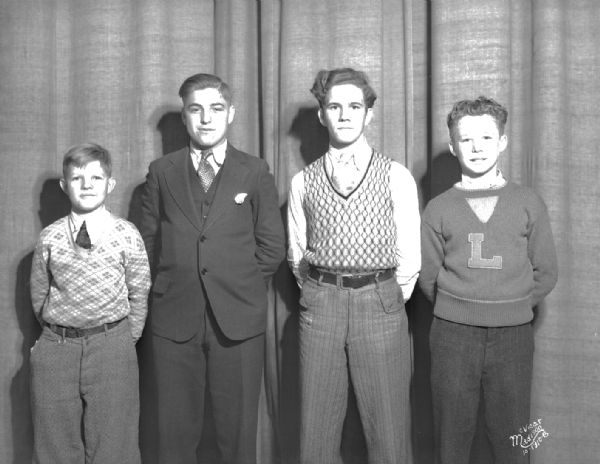 Group portrait of four East High School boys.