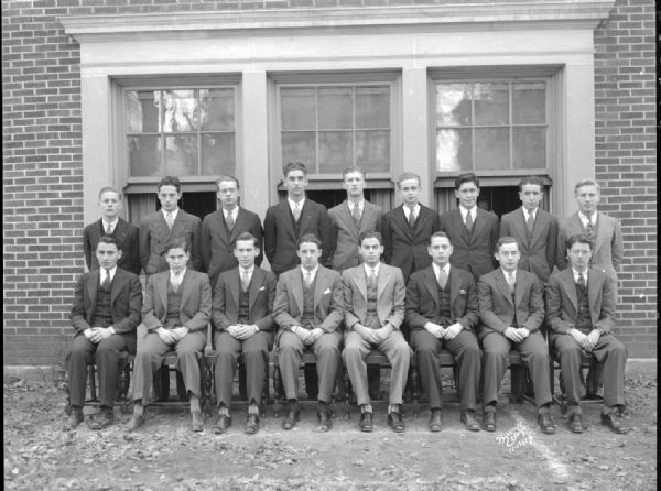 Group portrait of Pi Lambda Phi, 15 E. Gilman Street, showing 17 men.