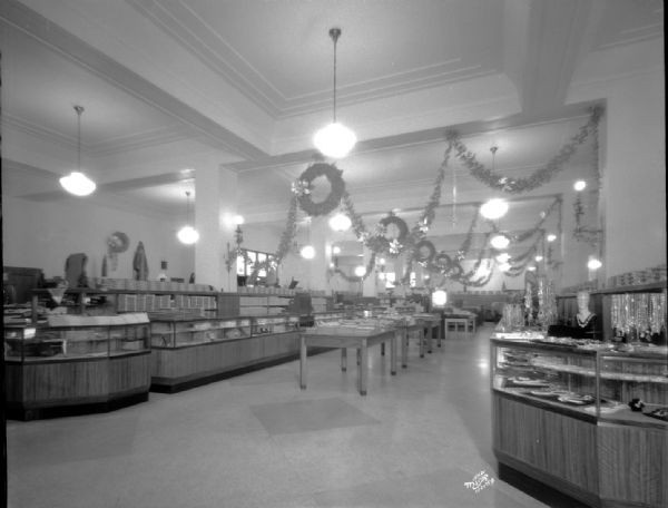 First floor (from Mifflin Street entrance) of Manchester's Department Store, showing Christmas decorations.