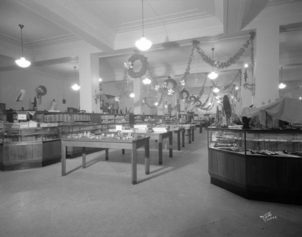 First floor of Manchester's Department Store, showing Christmas decorations.