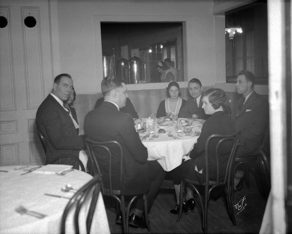 Karl Dane and George K. Arthur, Hollywood movie stars sitting at a table with six other people at the Park Hotel. One is Sol Levitan.