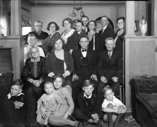 Howard Miner family group portrait. They are posing in an archway between rooms.