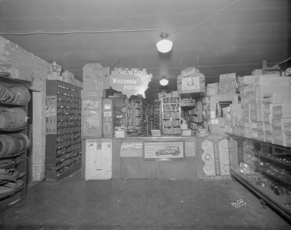 Charles H. Halperin store and stockroom, 209 S. Park Street. Showing sales counter and product displays of auto supplies.