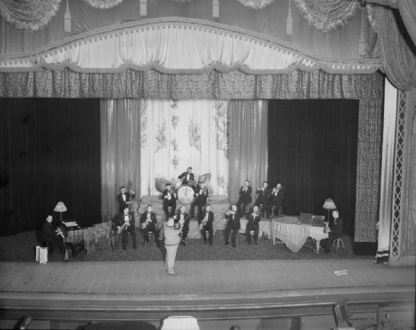 Elevated view of the combined RKO and Ross-Hobbs Century Serenaders orchestras with director performing at the RKO Orpheum theater.