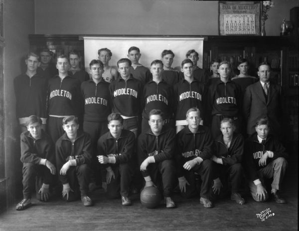 Group portrait of the Middleton High School boy's basketball team in uniform.