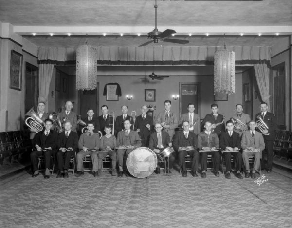 Group portrait of the I.O.O.F. (Independent Order of Odd Fellows) band, taken at the Odd Fellows Lodge, 308 W. Mifflin Street. Text on back of print reads: "Hope Lodge No. 17."