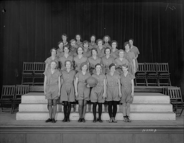 East High School junior girl's basketball team. The girls are dressed in bloomers.