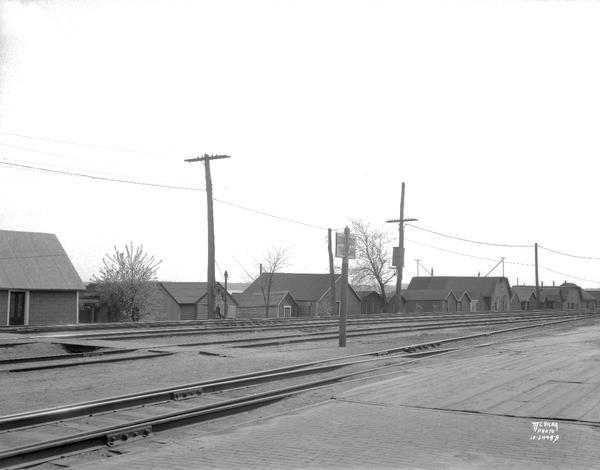 Boathouses on Lake Monona along E. Wilson Street looking southwest across the railroad tracks.