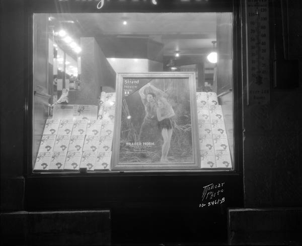 Walgreen's window, 30-32 E. Mifflin Street, advertising the movie "Trader Horn," with a poster and copies of the book on display.