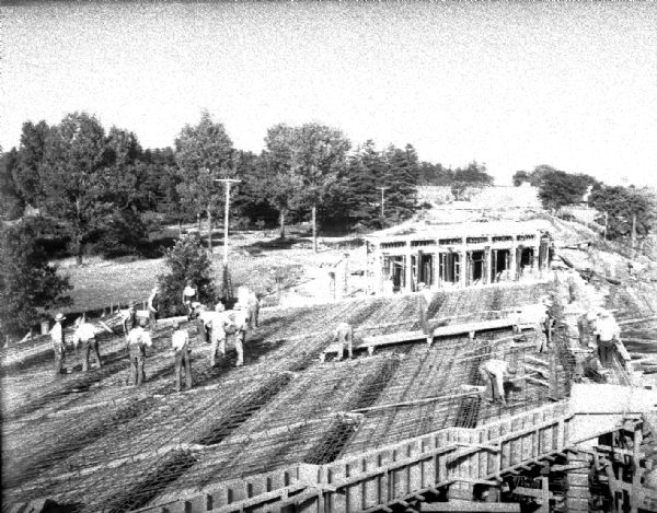 Construction of new overhead bridge — viaduct on US Highway 12 and 18 (West Broadway) across the North Western Railroad tracks near the Royal Airport.