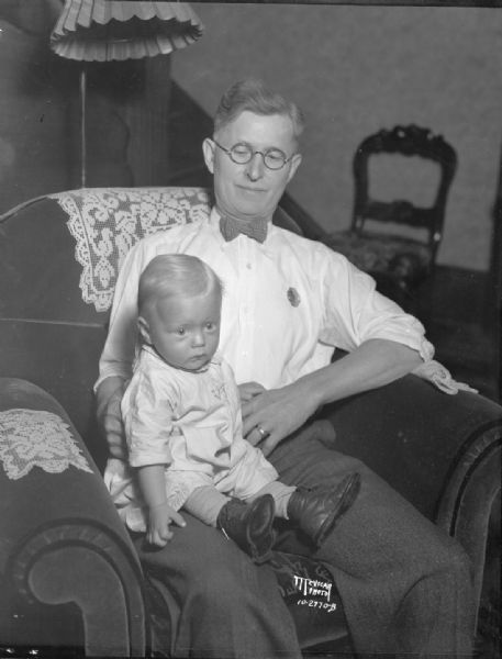 William Busse, humane officer, holding abandoned baby, Bobby LaBue (real name Bobby Yarborough of Spokane Washington).