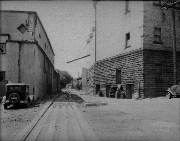 View towards the back side of the Fauerbach Brewery Building, 651-653 Williamson Street, showing railroad railroad tracks and siding.